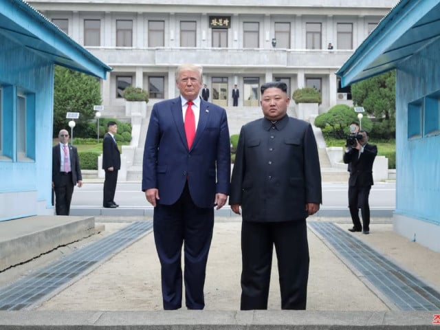 1 5 u s president donald trump and north korean leader kim jong un pose at a military demarcation line at the demilitarized zone dmz separating the two koreas in panmunjom south korea june 30 2019 photo reuters